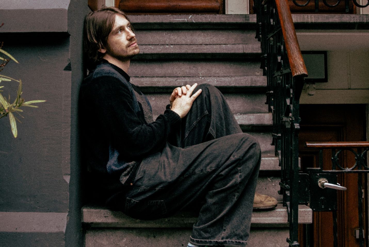Citizen Papes sat on the stairs